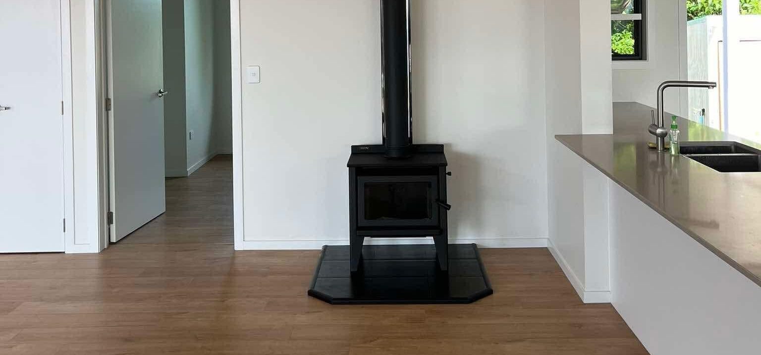 Wood burner fireplace on wooden floor